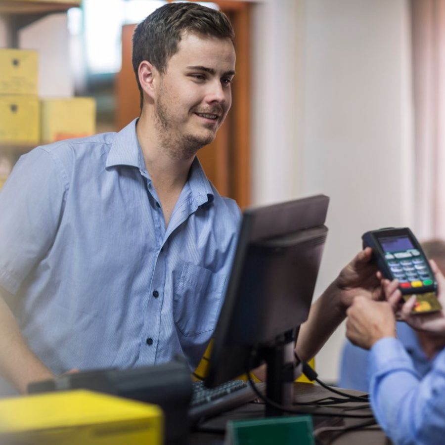 customer-using-credit-card-reader-at-store-2022-03-08-01-34-54-utc